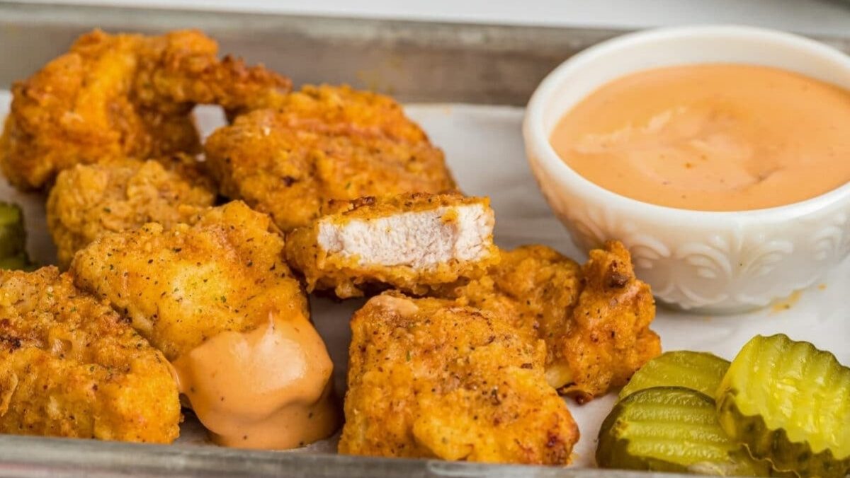 Air fryer nuggets on a sheet pan.