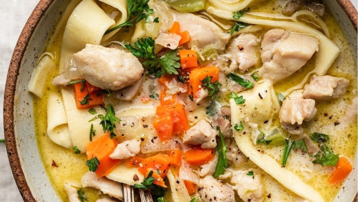 Creamy chicken noodle soup in a bowl.