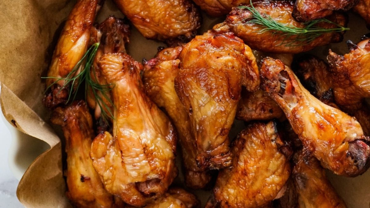 Game Day wings in a paper bag with sprigs of dill.