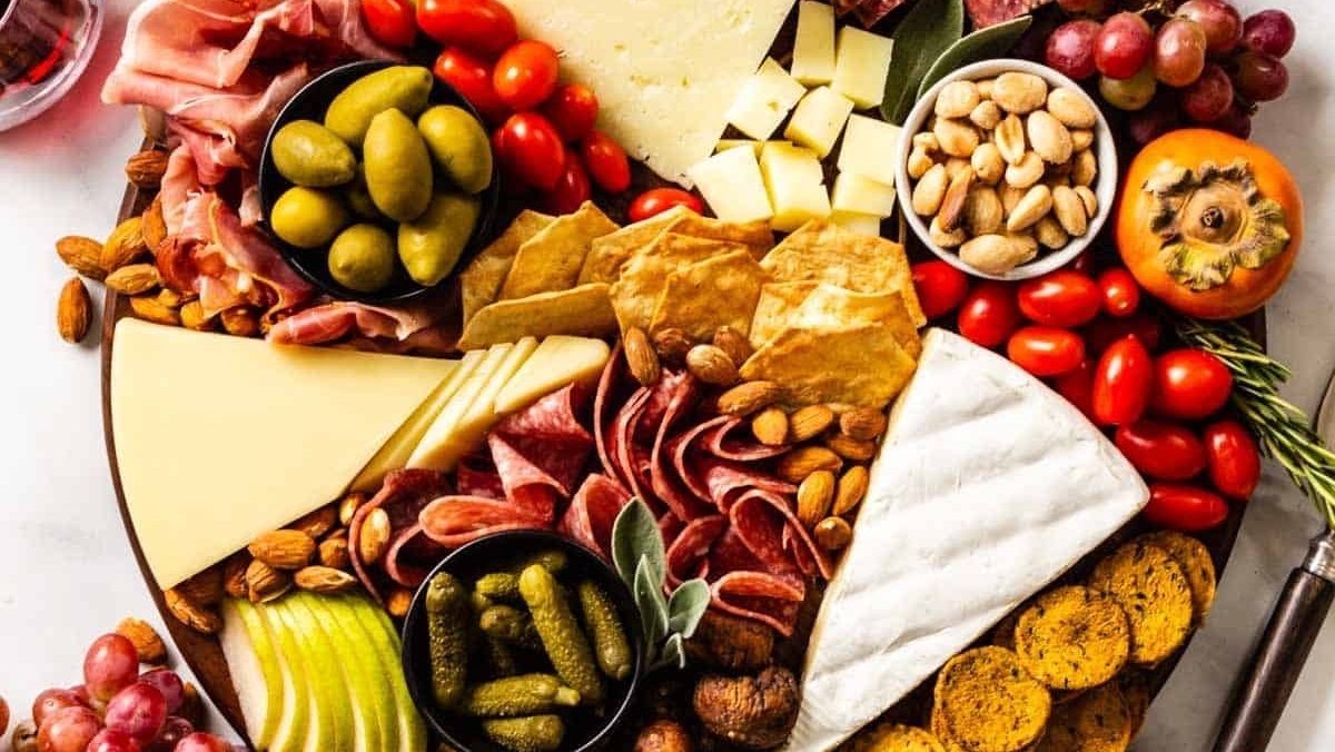 A Christmas charcuterie board featuring a variety of meats and cheeses.
