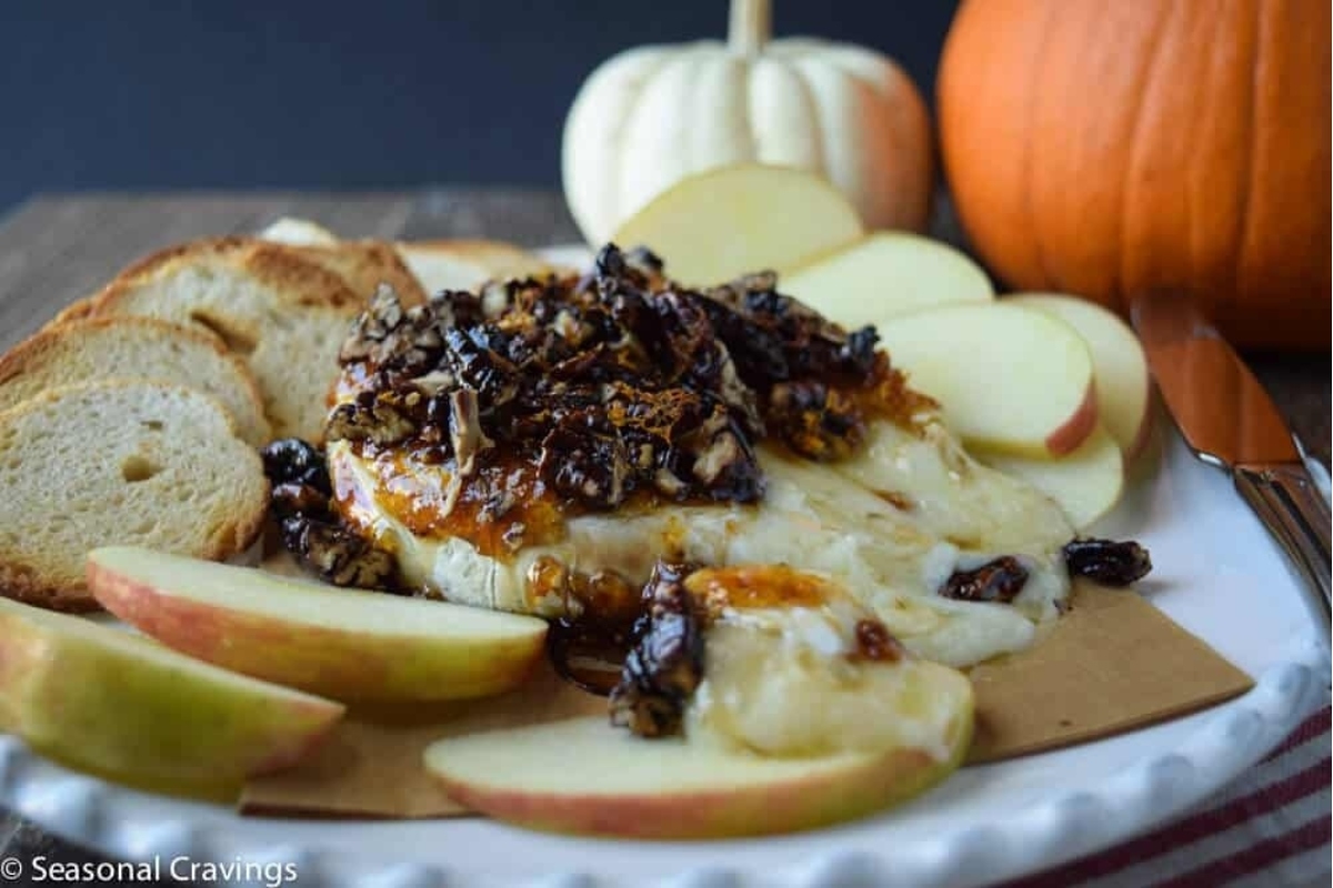 A plate with cheese and apples on it, perfect for appetizers or New Year's Eve.