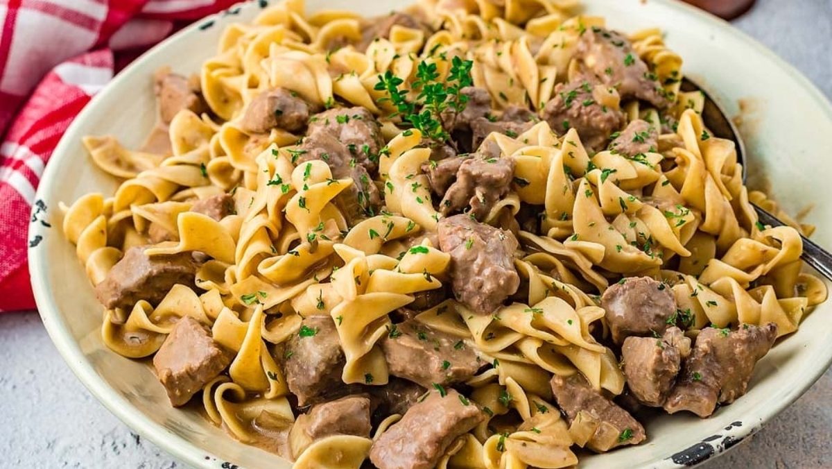 Comforting Swedish meatballs nestled in a white bowl, garnished with fresh parsley.