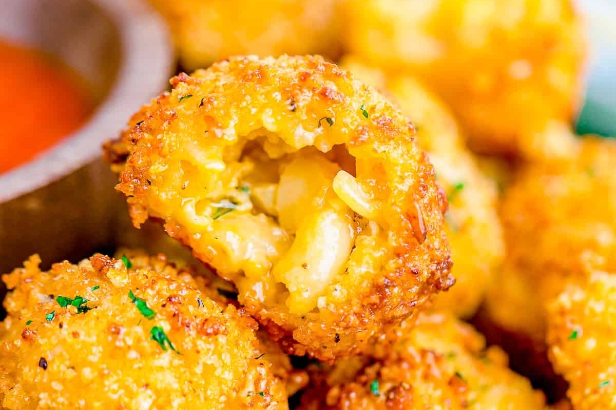 Bite-sized fried cheese balls perfect for game day, served with a delicious dipping sauce.