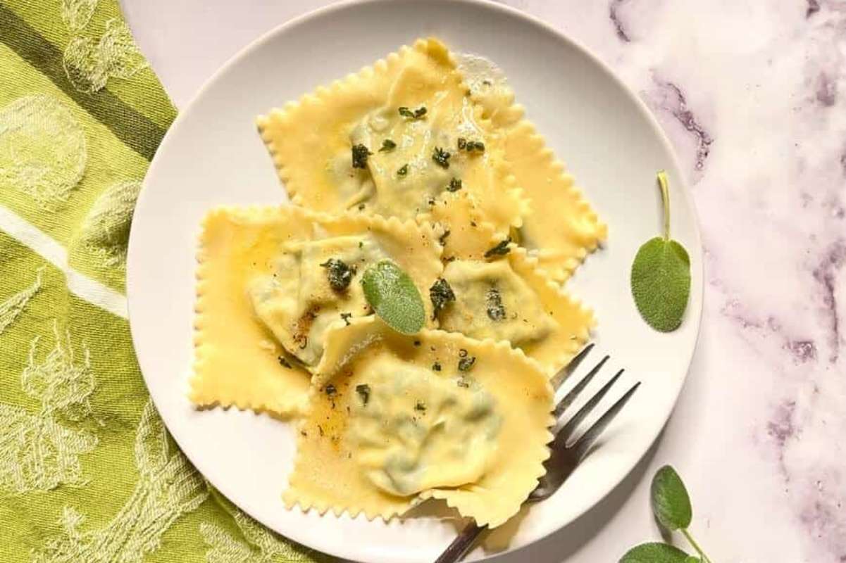 Homemade Spinach Ricotta Ravioli With Sage Butter Sauce.