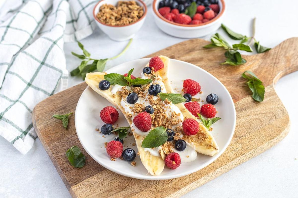 Healthy Breakfast Banana Split With Berries.