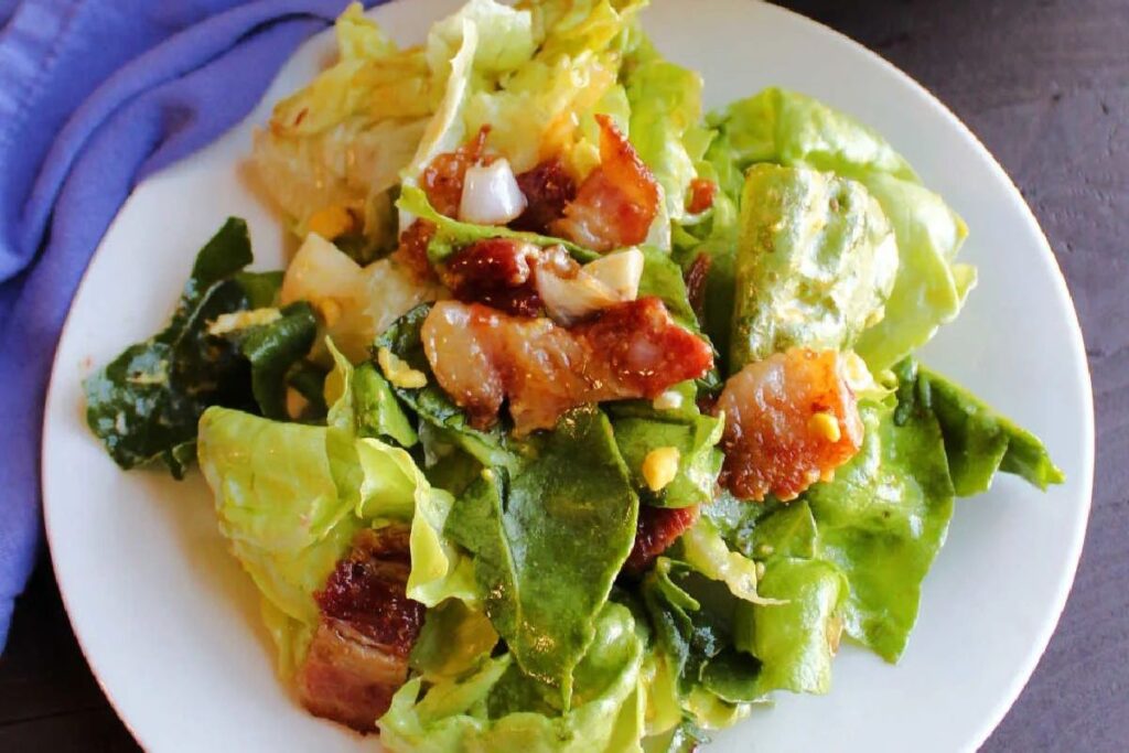 Wilted Lettuce Salad With Warm Bacon Dressing.